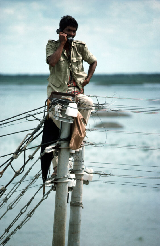 Technician checking electronics and telephone lines
